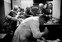 Weekly Tuesday morning selling of "kosher" meat in the basement of Krakow's kehilla, the building where the official Jewish community has its office and kosher kitchen. "It's as kosher as possible here", said the butcher/ritual slaughterer (shochate) referencing current conditions in Poland. 1979 