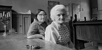 Golda Zeiden and daughter Regina in Wroclaw's only remaining prayer room (Beit Midrash).  Both survived Auschwitz.  1975 