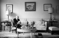 Isaac Bashevis Singer in his Manhattan apartment reading fan mail shortly  before flying to Stockholm to receive his Nobel prize for literature.