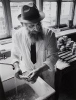 Moshe Shapiro, of Warsaw's Kosher Kitchen, washing meat.  Shapiro is the kitchen's ritual slaughterer and sees to the cleanliness of both the food and kitchen according to Jewish law.  Money for the food and operation of the kitchen comes from the American Jewish Joint Distribution Committee.