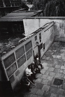 Awaiting Friday night services in the courtyard of Krakow's Remu synagogue.  The Remu is the oldest Polish synagogue still in use.  Services are held twice weekly.