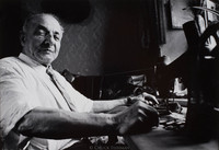 Chaim Elia Leder in his room in Lublin.  Leder receives a small monthly pension from the government and tries to supplement his income by sewing.  He is one of approximately 30 Jews remaining in Lublin.  In 1941 there were 45,000.