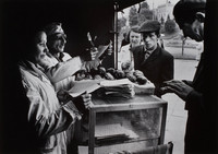 Robin Dawidowicz, the last Jew of Lublin's once Jewish market, and wife at work selling doughnuts.  His wife, a Christian, had recently been beaten up and called a Jewish whore.  They had been married for 4 months.  Dawidowicz endured Mauthausen Concentration Camp in Austria during the war.