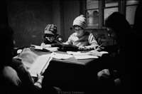 Learning Hebrew in Warsaw. The Nozyk Synagogue is seen through windows. 1978