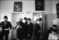 Warsaw's kosher kitchen at lunch after services in the Beit Midrash. Moshe Shapiro, center, waiting on line to receive his food. 1979 