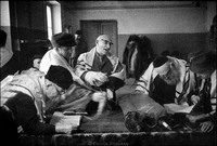 Shabbat morning service in Warsaw's Beit Midrash.  Solomon Klingkoffer, standing, center. 1979