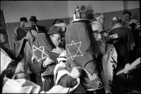 Shabbat service in Warsaw's Beit Midrash on Shavuoth.  Moshe Shapiro, front, and Natan Cywiak with Torahs. 1980