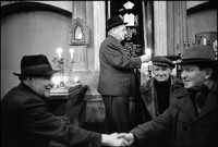 Preparing for Friday night services in the Remu Synagogue by lighting Shabbos and yahrzeit candles. Krakow 1978