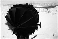 Auschwitz-Birkenau.  Searchlight from guard tower. Vast and deafeningly quiet. 1979