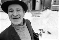 Natan Cywiak, shamus of Warsaw's Beit Midrash, after Shabbat services.  Entrance to Beit Midrash in background. 1979