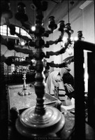 Mr. Wlodzimierz Sztejn, center, preparing for Friday night service in Krakow's Remu Synagogue. 1979