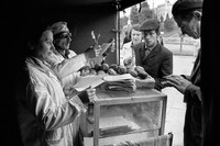 Robin Dawidowicz, the last Jew of Lublin's once Jewish market, and wife at work selling doughnuts. His wife, a Christian, had recently been beaten up and called a Jewish whore. They had been married for 4 months.  Dawidowicz endured Mauthausen concentration camp in Austria during the war. 1975 