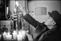 Lighting candles before Friday night services at Remu Synagogue. Krakow 1978
