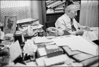 Simon Wiesenthal (1908-2005), Holocaust survivor and Nazi hunter, in his office at the Jewish Documentation Center in Vienna, Austria 1979. He's clipping articles from newspapers.