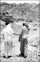 Walking with our Bedouin guide in the Sinai.  I saw rocks and old oil cans.
