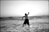 I'm skimming rocks in the Mediterranean north of Tel Aviv at sunset.  I like to watch them bounce off the water.