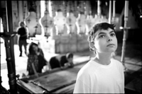 I'm in the Church of the Holy Sepulchre looking at a mosaic.  The slab behind me is supposedly where Jesus lay and people pray there.
