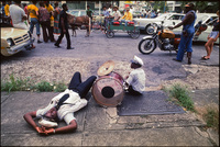 Exhausted drummer with Doc Paulin's brass band.  New Orleans 1978