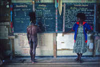 Teacher and student in classroom on traditional dress day. Tabubil, Papua New Guinea 1983