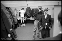 I'm trying on a suit in a men's dressing room.  I wasn't the only one trying on suits.
