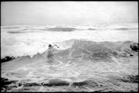 I'm trying to body surf in the Mediterranean.  There were a lot of jellyfish but I wasn't stung.
