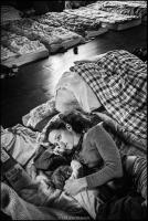 Ukrainian refugee mother with child in shelter. Krakow, Poland 2022