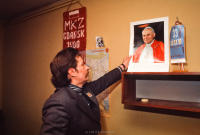 Lech Walesa putting up a new inscribed picture from his mentor Pope John Paul II
in his office at Solidarity headquarters, Gdansk, Poland. December 1980