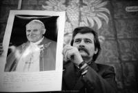 Lech Walesa in meeting at Solidarity headquarters council room, Gdansk, Poland, showing a personalized picture of Polish born Pope John Paul II. December 1980