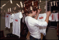 Hanging T-shirts, with printed Solidarity logo, to dry in the art department of Solidarity headquarters, Gdansk, Poland, Dec 1980