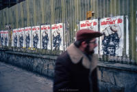 Man walking passed ROBOTNICY '80 (Workers '80) posters, Gdansk, Poland, December 1980