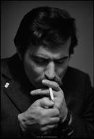 Lech Walesa lighting a cigarette in Solidarity headquarters, Gdansk, Poland. December 1980