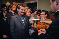Lech Walesa at Solidarity Christmas party at Solidarity headquarters. Gdansk, Poland December 1980. Anna Walentynowicz, the catalyst of the strike at the Lenin shipyards which developed into the Solidarity Trade Union, offering the traditional breaking of bread followed by kissing (oplatek), to Lech Walesa. Priest is Vicar Jankowski.
