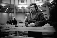 Lech Walesa at weekday morning church service before work at Solidarity headquarters. Gdansk, Poland December 1980