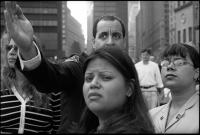 A family listening to a colleague of their father describing how and where their father died on 911 on the morning of the first ceremony at WTC / Ground Zero marking the official completion of separation of human remains from 1.8 million tons of debris and removal of both, NY, NY, May 30, 2002